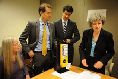 Karen Gourgey (right) demonstrates an APS to Council Members Mark Levine and Ydanis Rodriguez